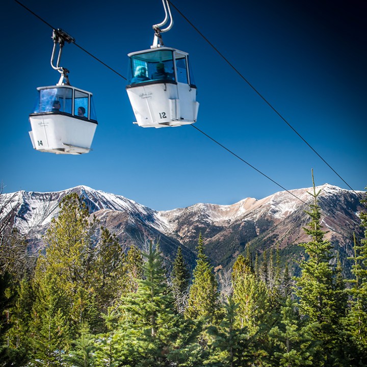 a tower with a mountain in the background